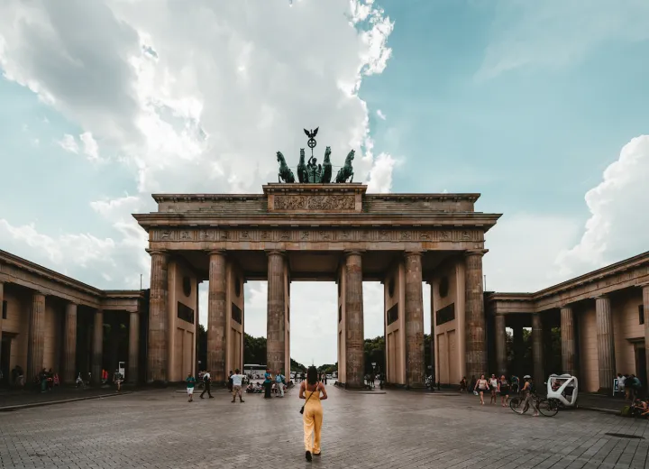 The Brandenburg Gate in Berlin beneath a blue-grey sky