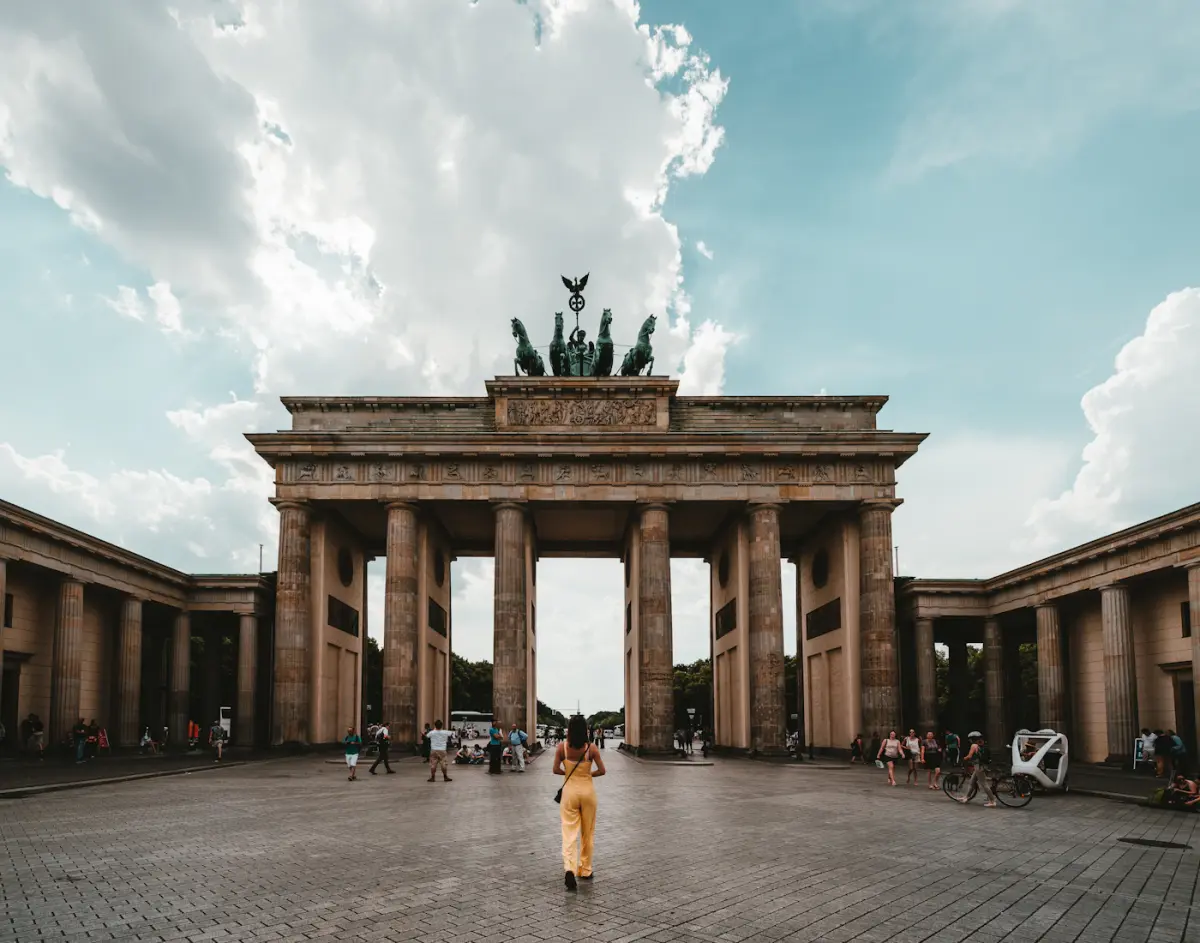 The Brandenburg Gate in Berlin beneath a blue-grey sky