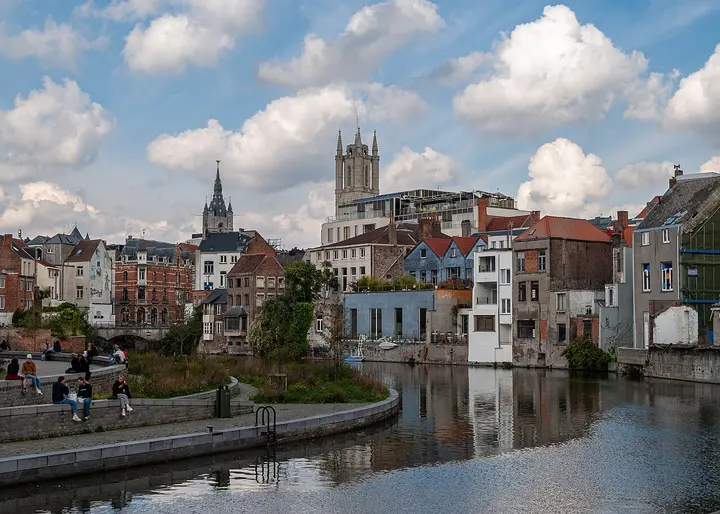 Buildings and church towers beside the water in Ghent.