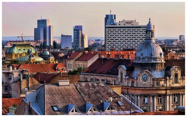 Roofs, domes and modern buildings across the Zagreb skyline.
